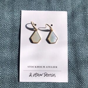 Earrings “and other stories” pierced